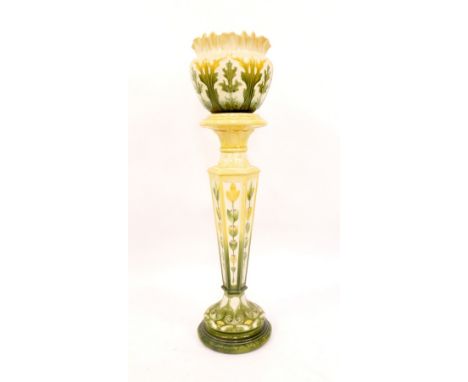 An Art Nouveau pottert jardiniere and stand, with green and yellow floral flared rim bowl, with leaf detailing, stamped LAP L