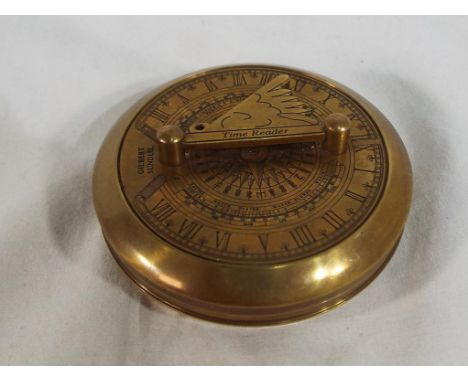 A brass time reader / sundial by Gilbert