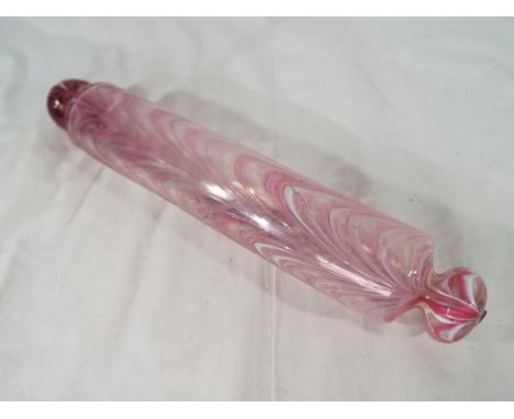 A late 19th C / early 20th C glass rolling pin, the hand blown cylinder with handles and pink and white inclusion trails, app