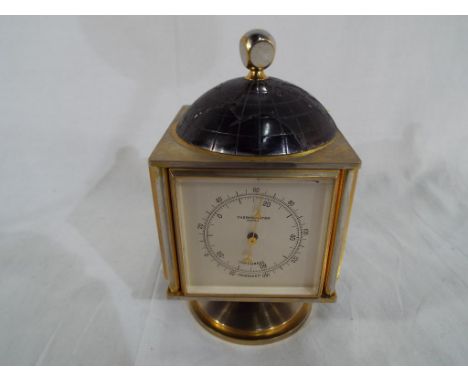 A Bucherer Swiss made vintage Imhoff rotating clock / weather station with Clock, Barometer, Hygrometer and Thermometer on a 