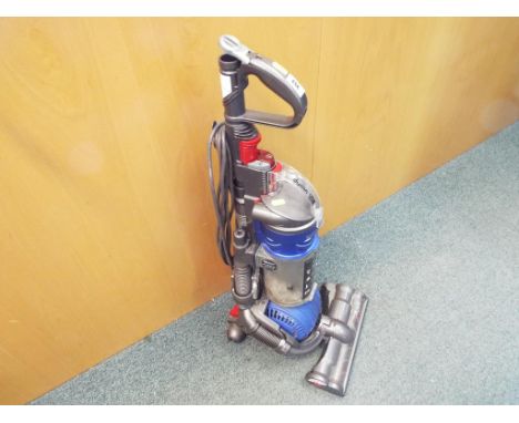 Dyson - a Dyson upright vacuum cleaner DC24 serial no. CE8 - UK - CJE0167A with accessories, operating manual and similar