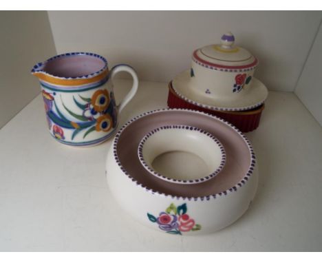 Poole Pottery - three mid 20th C pieces comprising a floral circular trough vase, a lidded jam pot and a jug - Est £20 - £40