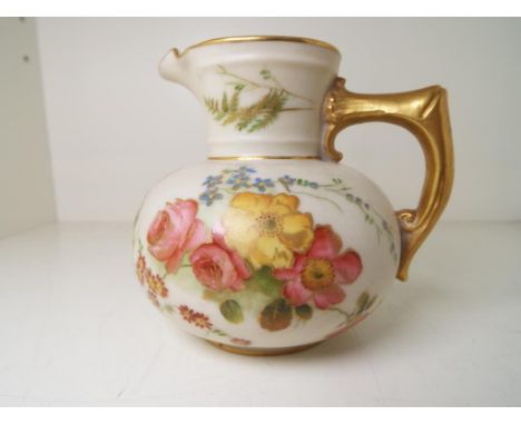 Royal Worcester - an ivory and gilt cream jug of baluster form, hand painted with spring and summer flowers, shape no 1376, p