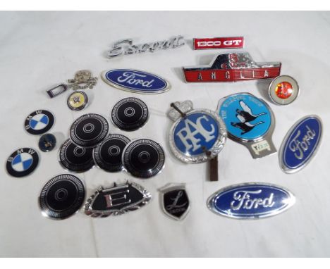A quantity of vintage and modern car badges, brooches and similar.