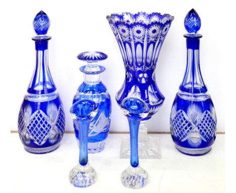 A SMALL COLLECTION OF DECORATIVE BLUE FLASHED GLASSWARE, COMPRISING A CUT GLASS WAISTED VASE ON CLEAR FOOT, 35CM H, ONE AND A