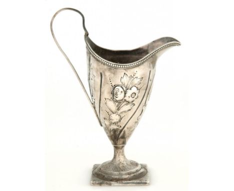 A GEORGE III SILVER CREAM JUG, OF HELMET SHAPE, LATER CHASED, 15CM H, MARKS OBSCURED, C1795, LOADED 