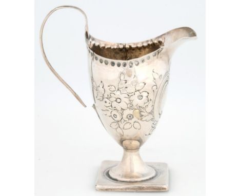 A GEORGE III SILVER CREAM JUG OF HELMET SHAPE, ON SQUARE FOOT, LATER CHASED, 13CM H, LONDON 1795, 3OZS, HANDLE PARTLY DETACHE