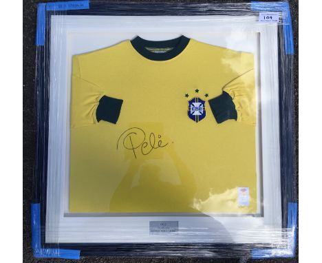 Pele Brazil Signed 1970 World Cup Framed Shirt: Expensively framed in original wrapping. Yellow shirt signed clearly in marke