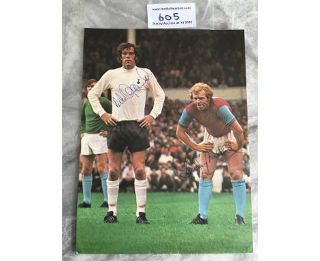 Bobby Moore West Ham Signed Football Picture: Large size colour magazine picture of Moore in West Ham kit and Mike England in