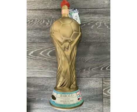 World Cup Trophy Italy 1990 3 Litre Wine: Gold in the shape of the World Cup with flags of participating nations. Barolo 1984