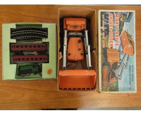 A Triang Railways 00/HO gauge RP - a train set (Clockwork) and a Mighty Brute shovel-dozer by Marx Toys - Boxed 