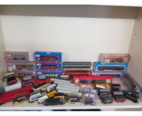 A quantity of Hornby and other Carriages and Goods Wagons - boxed  and a large quantity of unboxed Wagons including Grafa , H