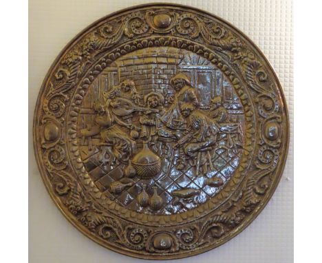 Vintage repousse decorated large circular wall plaque. Approx. 63cms D

reasonable used condition 