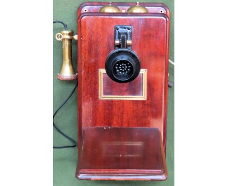 Vintage Mahogany wall mounting telephone

Used condition, unchecked 