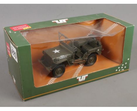 A boxed UT Models Willy's Jeep die cast 1:18 model.  