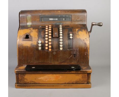 An early Twentieth Century National Cash Register; 1817 SE. With scumble glaze steel frame, crank handle and lead lined till 