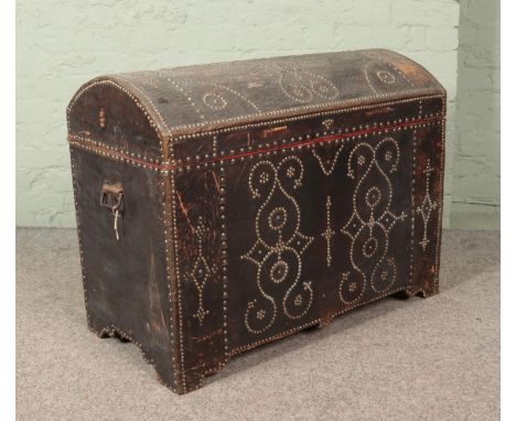 An antique Eastern style trunk with studded decoration. 70cm x 90cm x 48cm.  