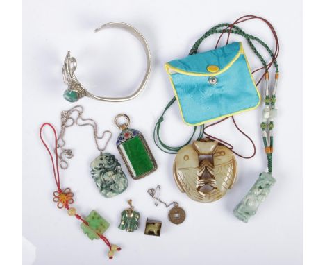 A collection of Jade, Jadeite and Jade coloured jewellery including Jadeite pendant on silver necklace, soapstone kissing fis