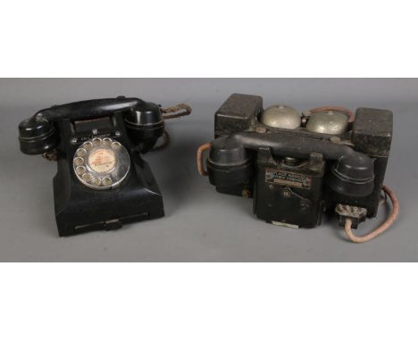 A British Telephone Set 'F' MKII TMC field telephone, together with a black vintage rotary dial telephone.  