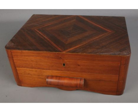 A two tiered assembled canteen of cutlery, set within a fitted quarter-veneered case. Contains Frank Cobb and W.Greenwood, Le