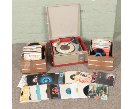 Two boxes of assorted vinyl single records along with a portable BSR record player. Includes Elton John, Leo Sayer, Kool and 