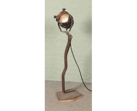 A vintage theatre light with bespoke metal stand.  
