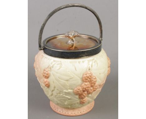 A Locke & Co Worcester ceramic biscuit barrel with metal lid and swing handle.  