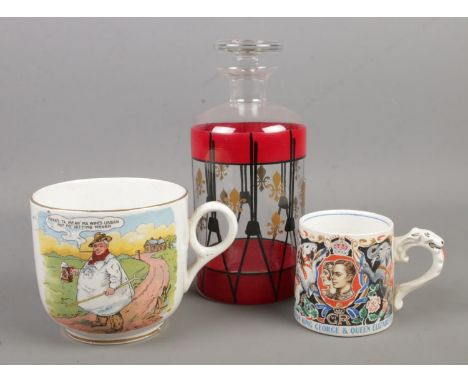 A J&amp;G Meakin coronation cup designed by Laura Knight, along with a Tykes motto mug and a hand painted decanter.  