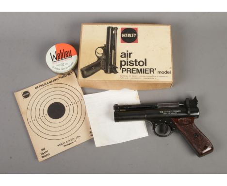 A boxed Webley &amp; Scott 'Premier' model .22 caliber air pistol. Includes tin of .22 pellets, target No.1 and component she