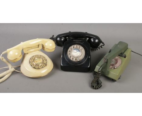 Three vintage/retro telephones, including two rotary dial examples.  