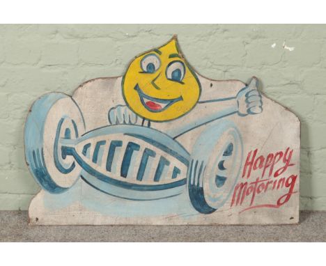 A vintage painted wooden board advertising Esso, 'Happy Motoring'. 60cm x 86cm.  