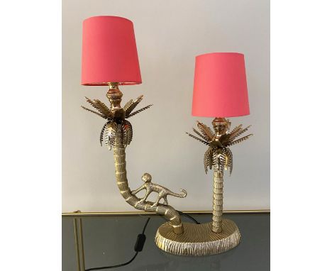 TABLE LAMP, two branch form, depicting a monkey climbing a tree, gilt metal, pink shades, 50cm high, 32cm wide, 15cm deep. 