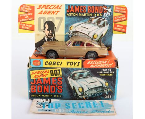 Corgi Toys 261 James Bond Aston Martin D.B.5 from the Film “Goldfinger” gold body, with working ejector seat, retractable mac