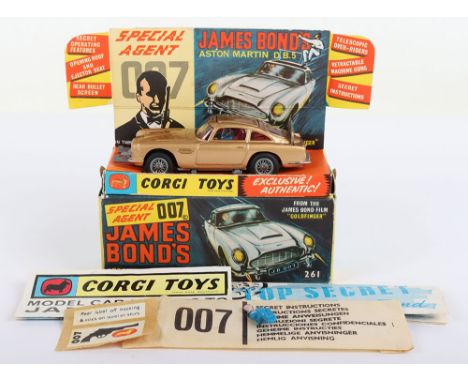 Corgi Toys 261 James Bond Aston Martin D.B.5 from the Film “Goldfinger” gold body, with working ejector seat, retractable mac