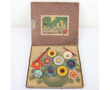 Rare boxed set of Marklin tinplate flower spinning tops, 1920s, ten hand painted flower tops and two driving handles, boxed w