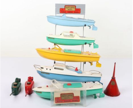 Sutcliffe original shop display stand and five boats, circa 1960s, electric Kestrel Cruiser, good working condition lacks fla