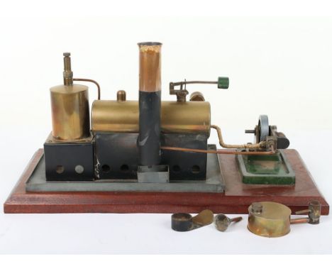 A live steam plant and single cylinder engine, with brass vertical boiler with burner and safety valve with piping to horizon