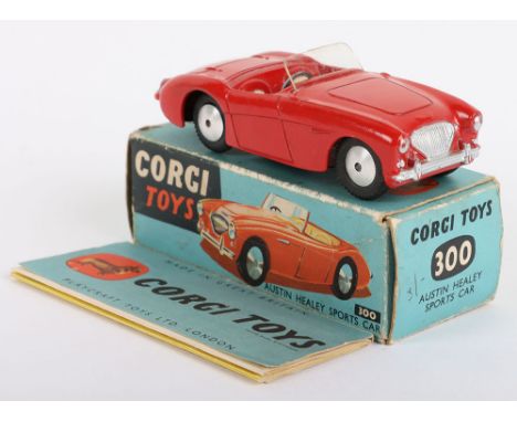 Corgi Toys 300 Austin Healey Sports Car, red body, cream seats, flat spun wheels, in near mint original condition, early blue