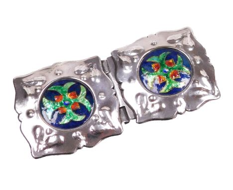 A late 19thC Arts and Crafts pewter and enamel belt buckle, the enamel roundels decorated with a cross, within an embossed fr
