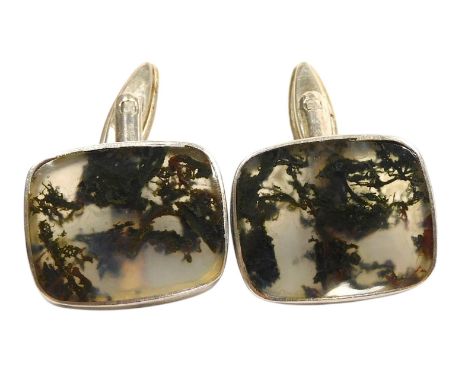 A pair of moss agate cufflinks, of cushion form, in white metal.
