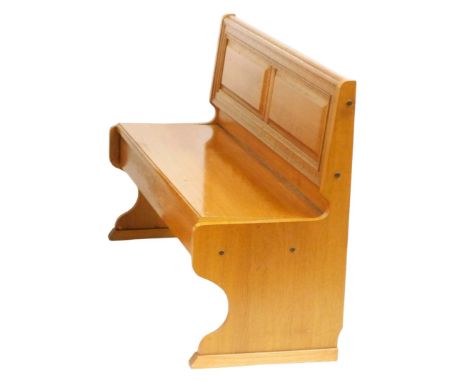 A light oak pew, with a panelled back, 140cm wide. 