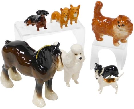 A group of Beswick pottery animals, including a toy poodle, dachshund, collie and two corgis, and a further pottery figure of