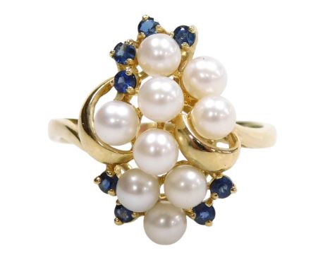 A 9ct gold sapphire and seed pearl ring, in a scrolling mount, size T, 4.1g.