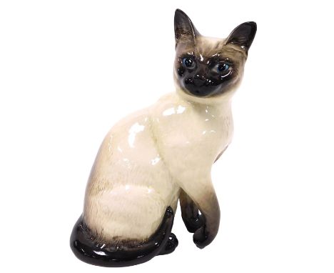 A Beswick pottery figure of a Siamese cat, number 1882, printed and impressed marks, 29cm high. 