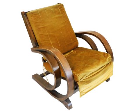 An Art Deco bentwood armchair, with gold coloured draylon cushions, on shaped end supports.