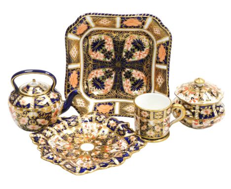 A group of Royal Crown Derby Imari porcelain, comprising a miniature mug and kettle, dressing table pot and cover, and two di