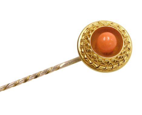 A Victorian Etruscan style coral tie pin, in a circular recessed, pierced and wirework mount, yellow metal, 2.8g.