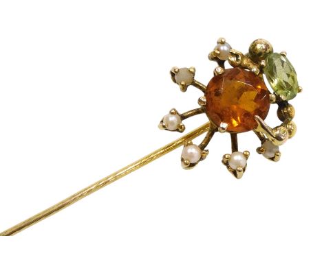 A citrine peridot and seed pearl tie pin, in a floral design, in a yellow metal mount, 2.7g.