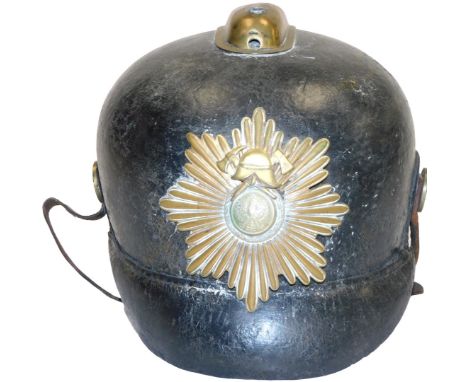 A WWI era Imperial German Pickelhaube fireman's helmet, with brass comb, and plate to the front bearing the Imperial eagle, l