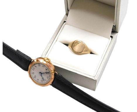 A 9ct rose gold lady's wristwatch, circular silvered dial with engine turned decoration, bearing Arabic numerals, on a leathe